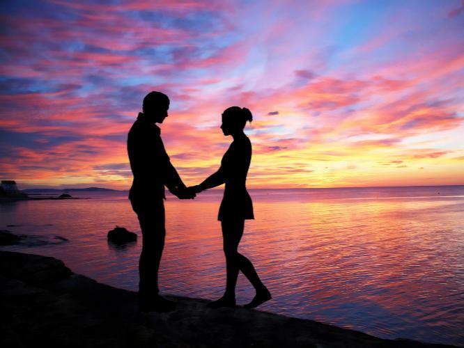 Man and woman holding hands